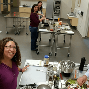 coworkers take a selfie at a cooking class