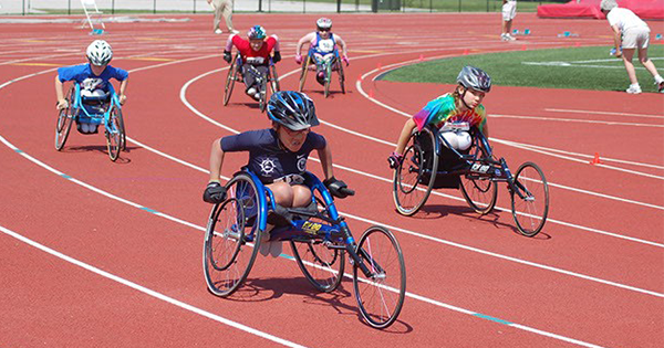 Athletetes with disabilities on bikes in a race