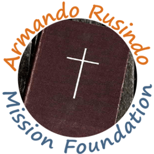 Armando Rusindo Mission Foundation logo in black, blue, orange, and white
