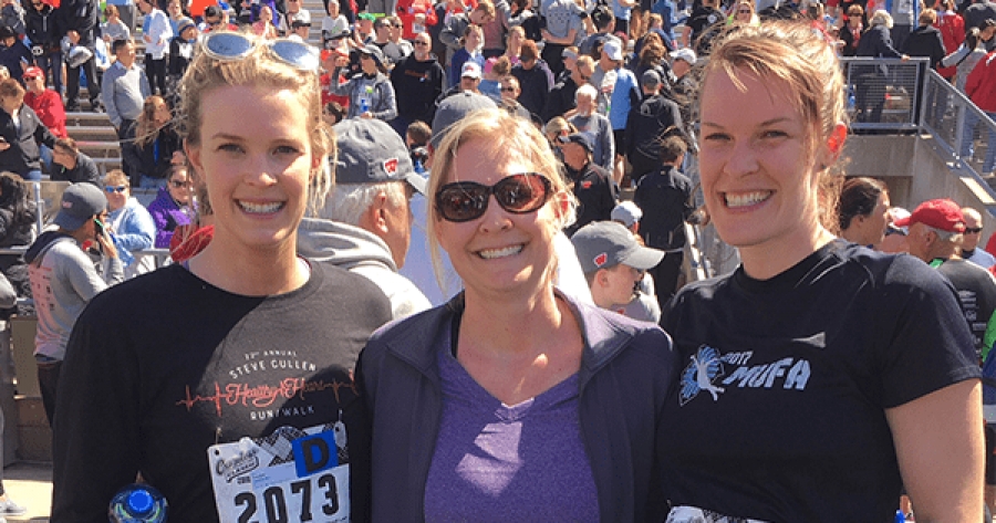 female coworkers smiling at a race