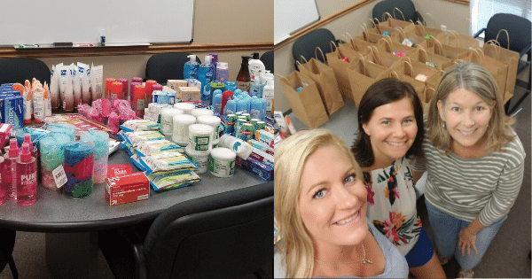 Loose items and bagged items on table ready for donation with female coworkers smiling