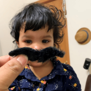 Yound child with fake mustache