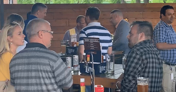 coworkers sitting around a table talking at a restaurant