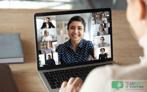 Employee on virtual meeting with team on laptop