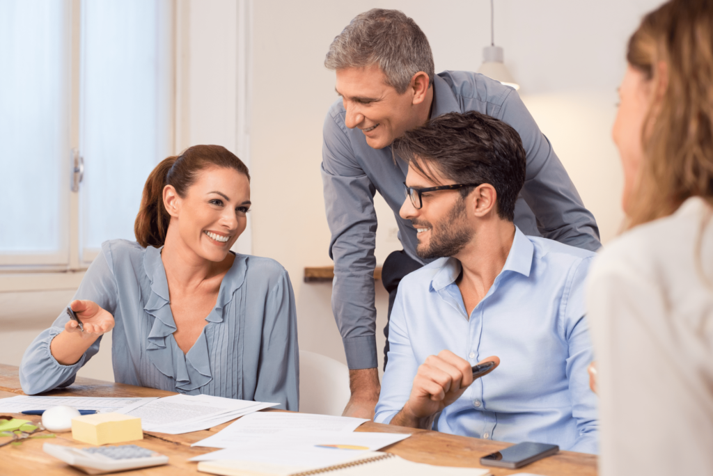 couple of coworkers having a meeting with financial service rep