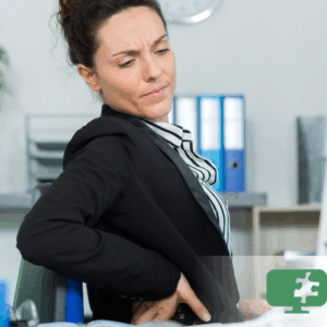 Technology professional experiencing back pain from prolonged sitting.