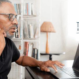Tech employee on a call troubleshooting and using laptop.